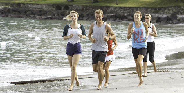 Work on your fitness by the beach as couple
