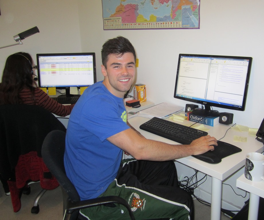 Alex at his desk at Health and Fitness Travel HQ