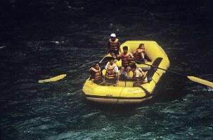 Group of people white water rafting as part of their holiday to Ananda in the Himalayas in India