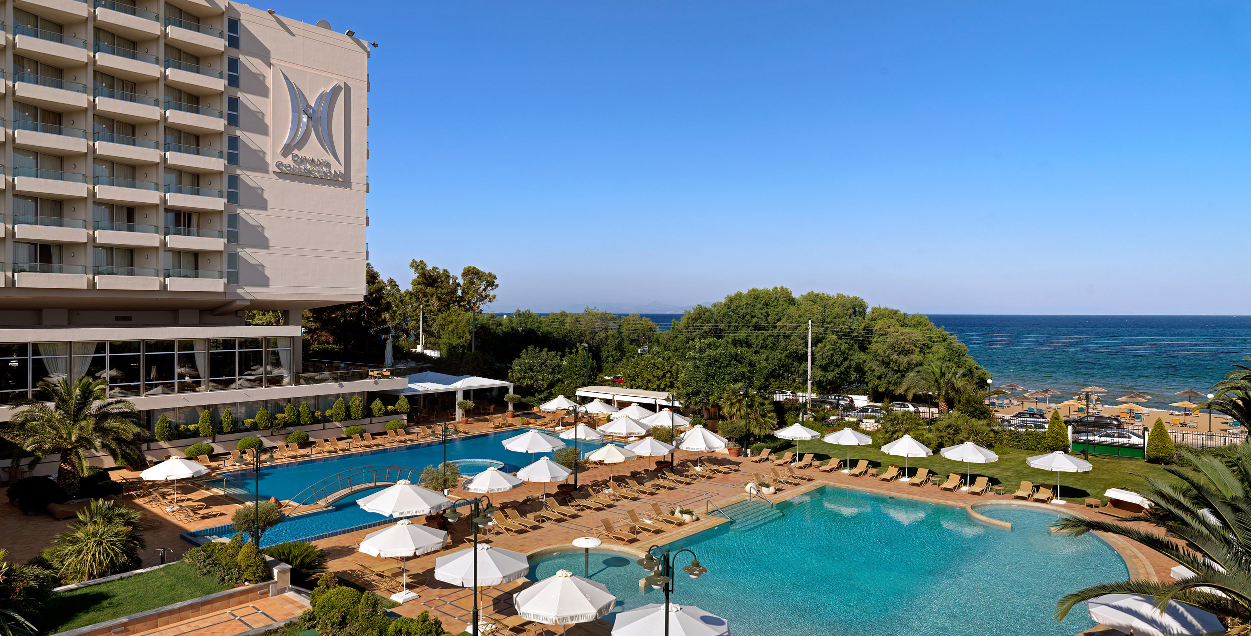 Swimming pool and sun beds by the sea