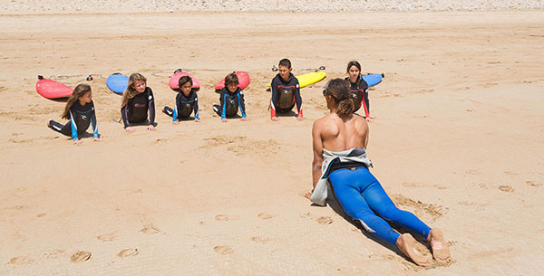 Children learning surfing at Paradis Plage's surf school