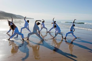 Beach yoga class at Paradis Plage