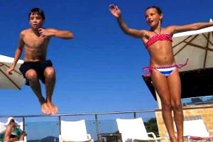 Children playing volleyball on the beach