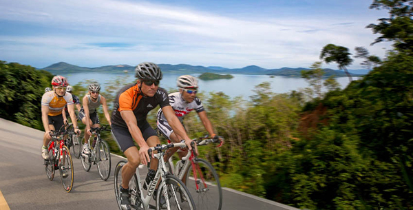 Triathletes cycling through exotic Thailand at Thanyapura