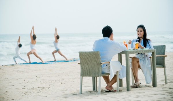 Dine together on the beach at Fusion Maia