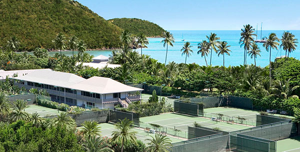 Play tennis on a luxurious couples wellness retreat in Antigua at Carlisle Bay