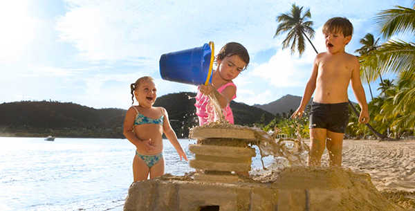 Build sandcastles on the beach at Carlisle Bay