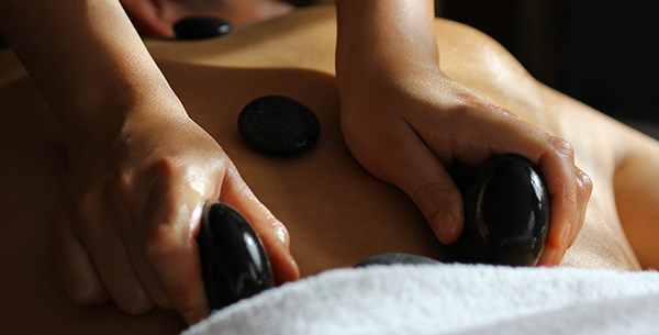 Experience a hot stone massage at Zighy Bay