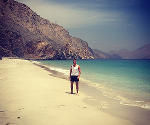 paul on the beach at Six Senses Zighy Bay in Oman