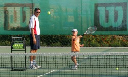 Children's tennis coaching lesson at Aphrodite Hills in Cyprus
