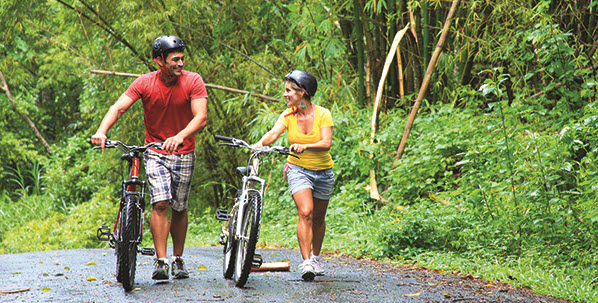 couple biking in thailand