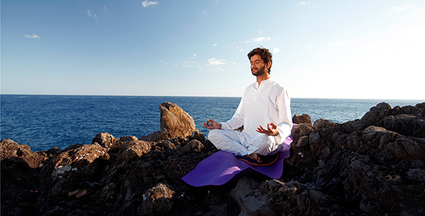 Experience meditating on the beach at Galo Resort