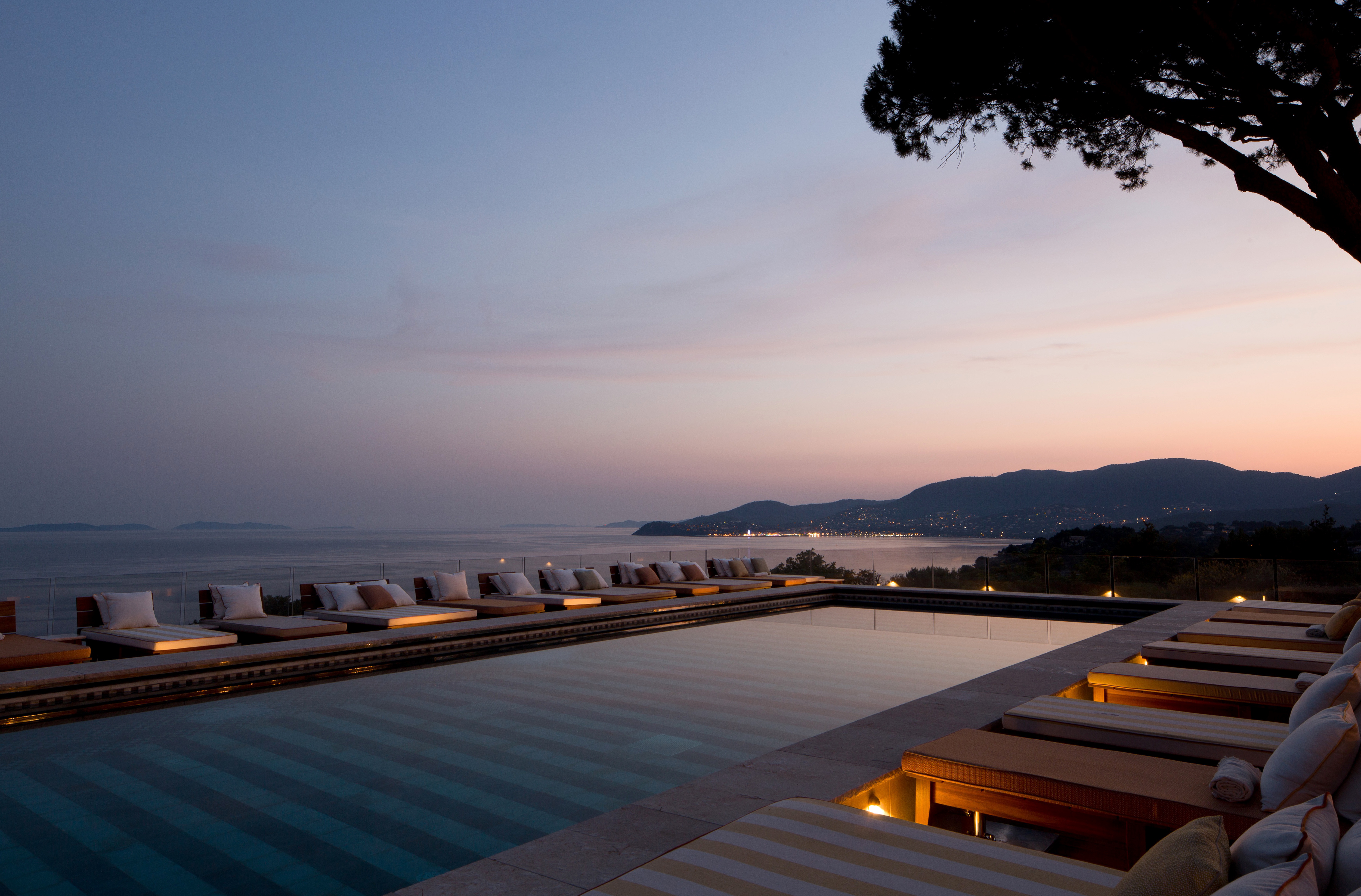 Lounging area at a French wellness resort looking out onto the ocean