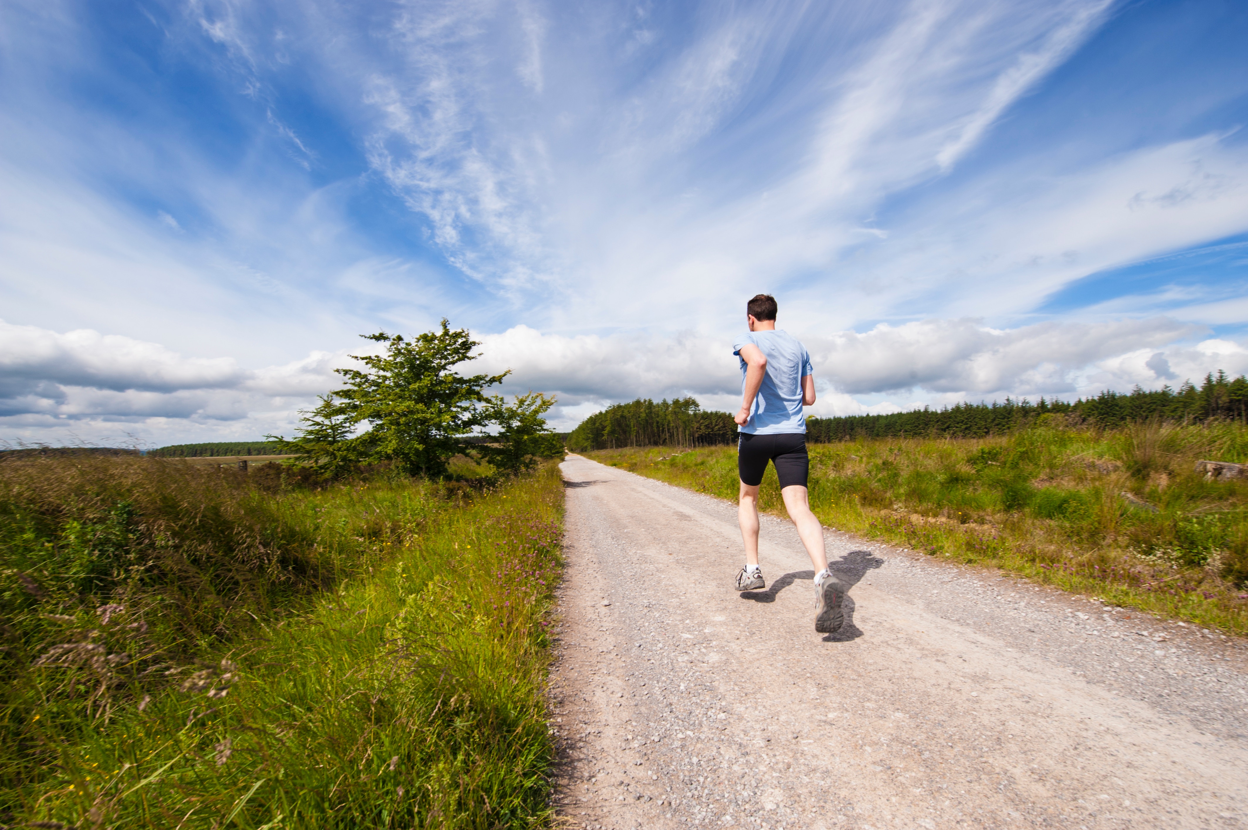 man going for a run in the countryside on holiday