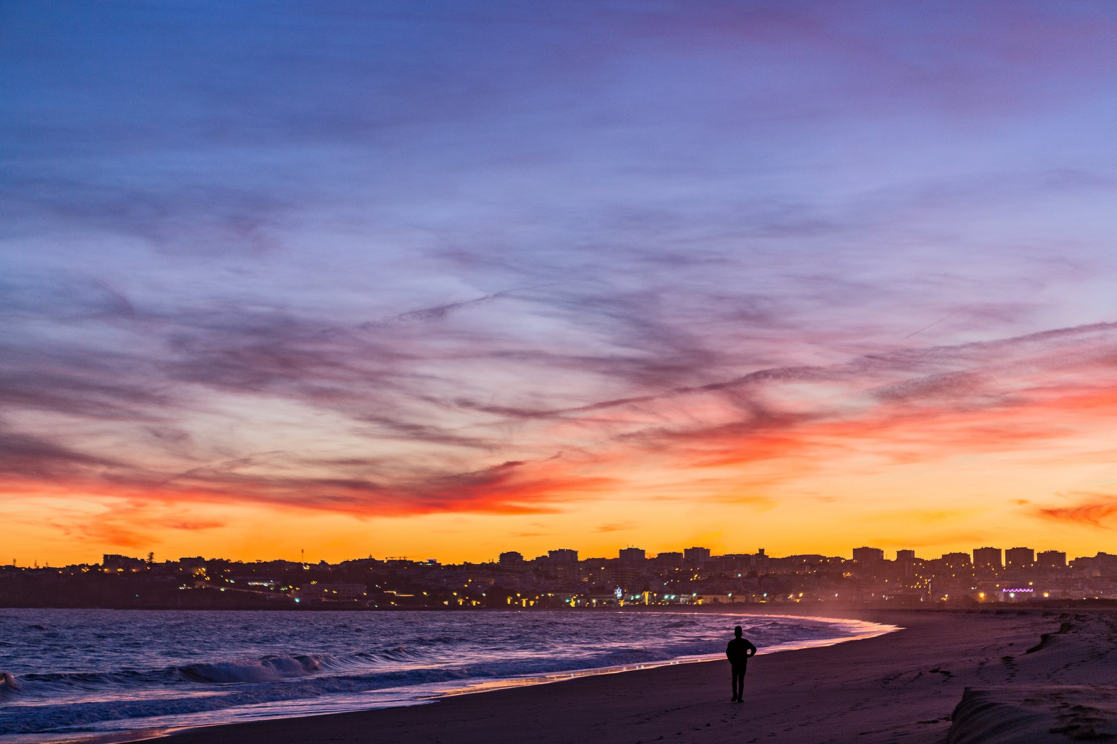 Nightscape photograph of a person on the beach in Portugal