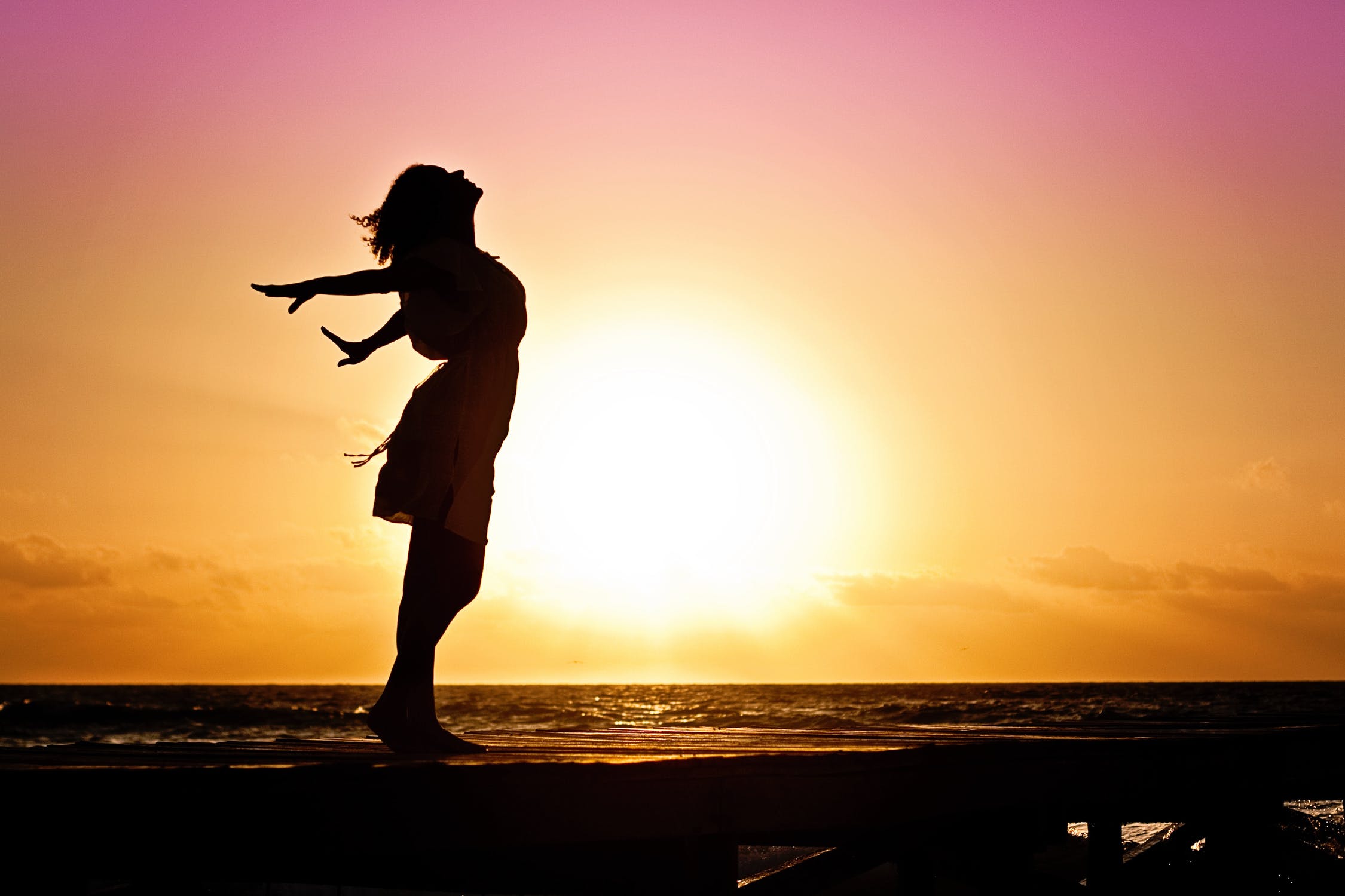 woman on the beach at sunset