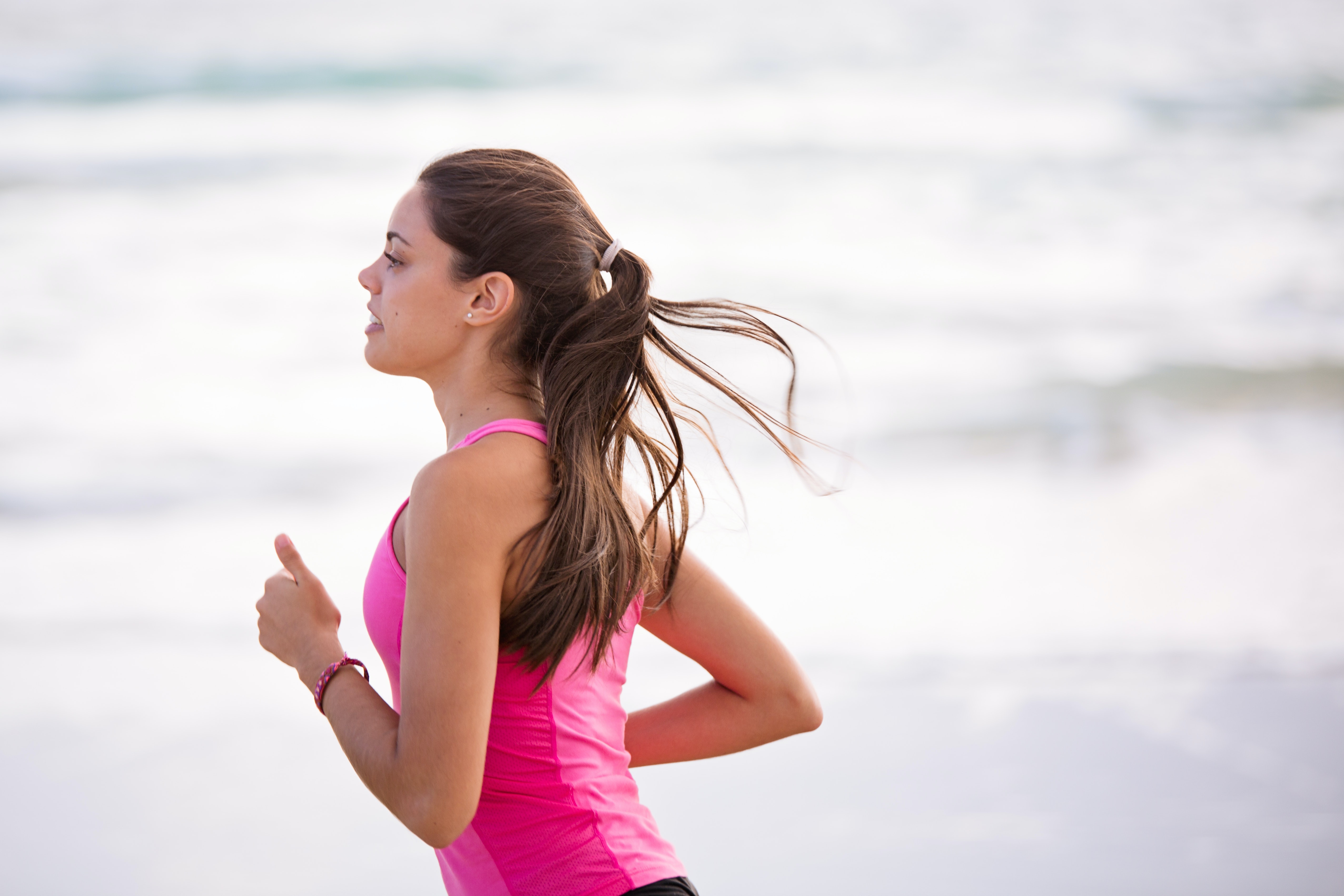 Woman running by the sea