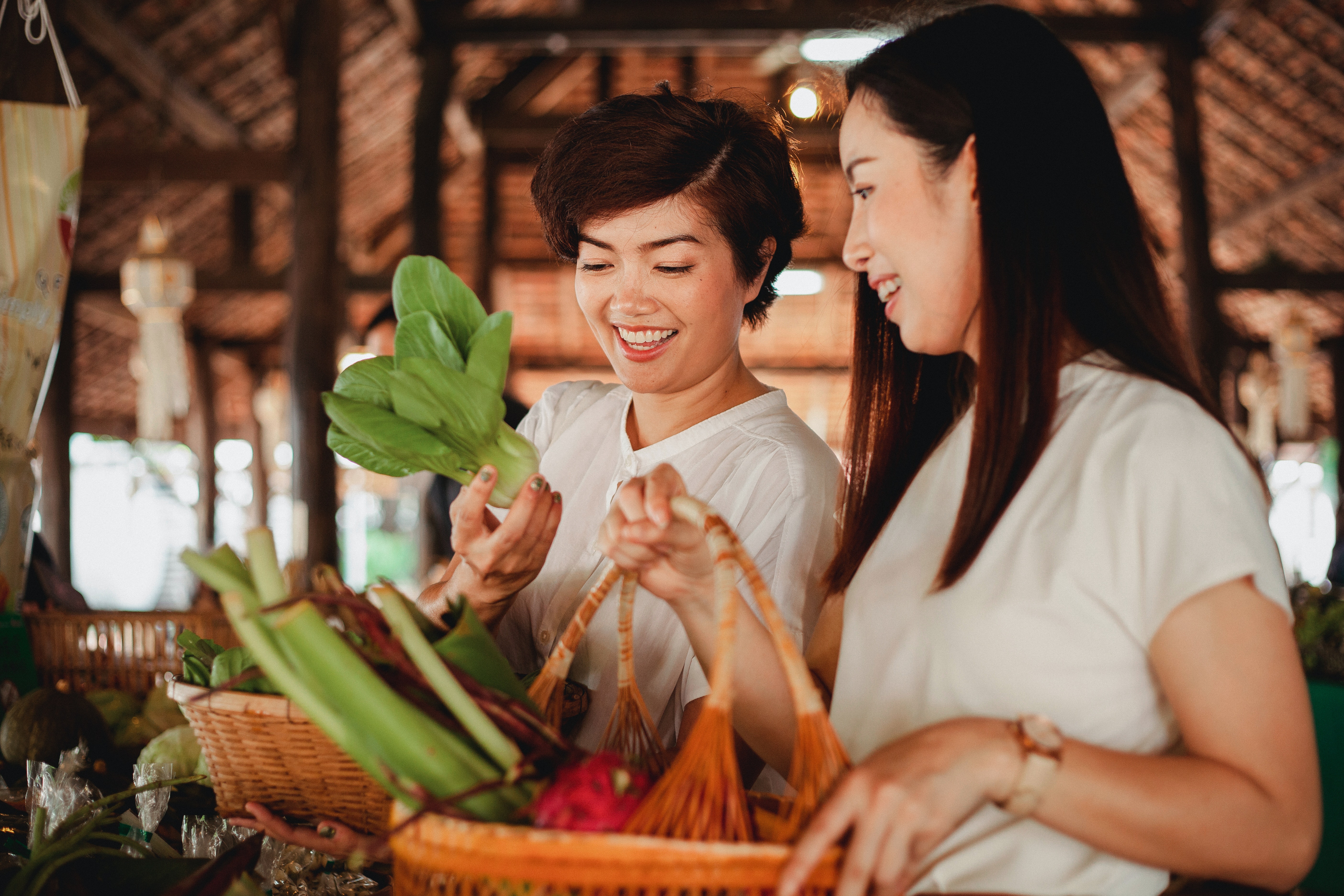 Two women shopping for vegetables