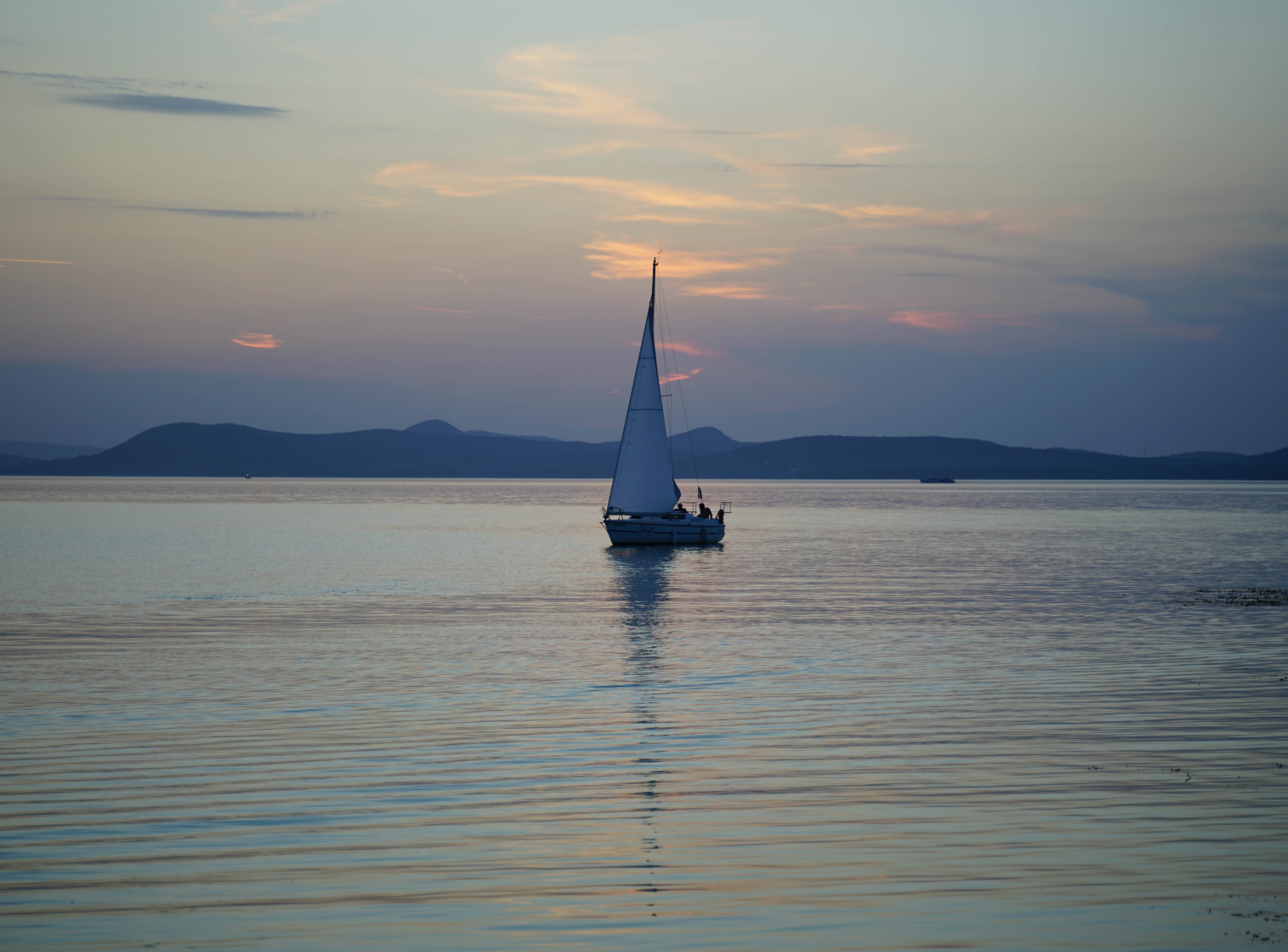 sailing boat at sunset on the sea