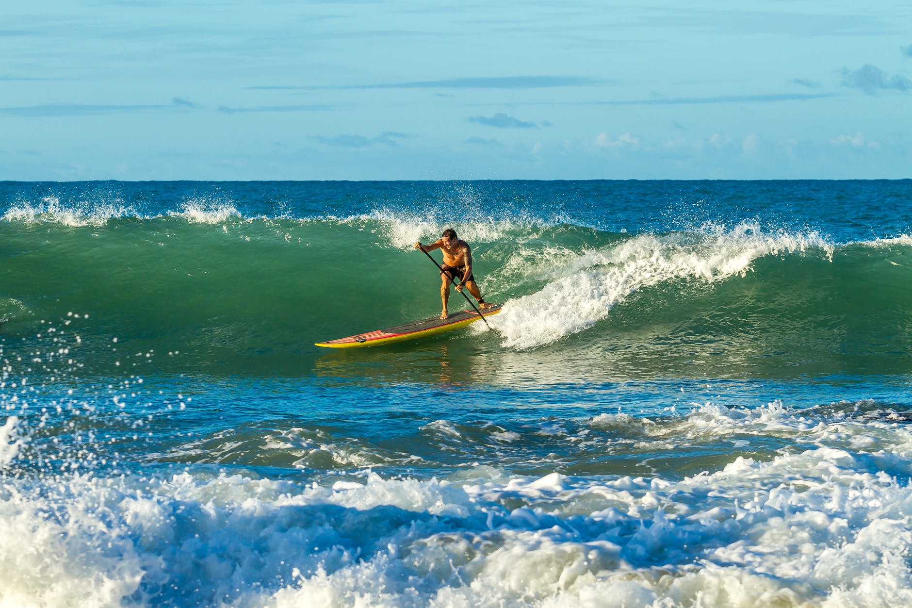 Person stand up paddleboarding