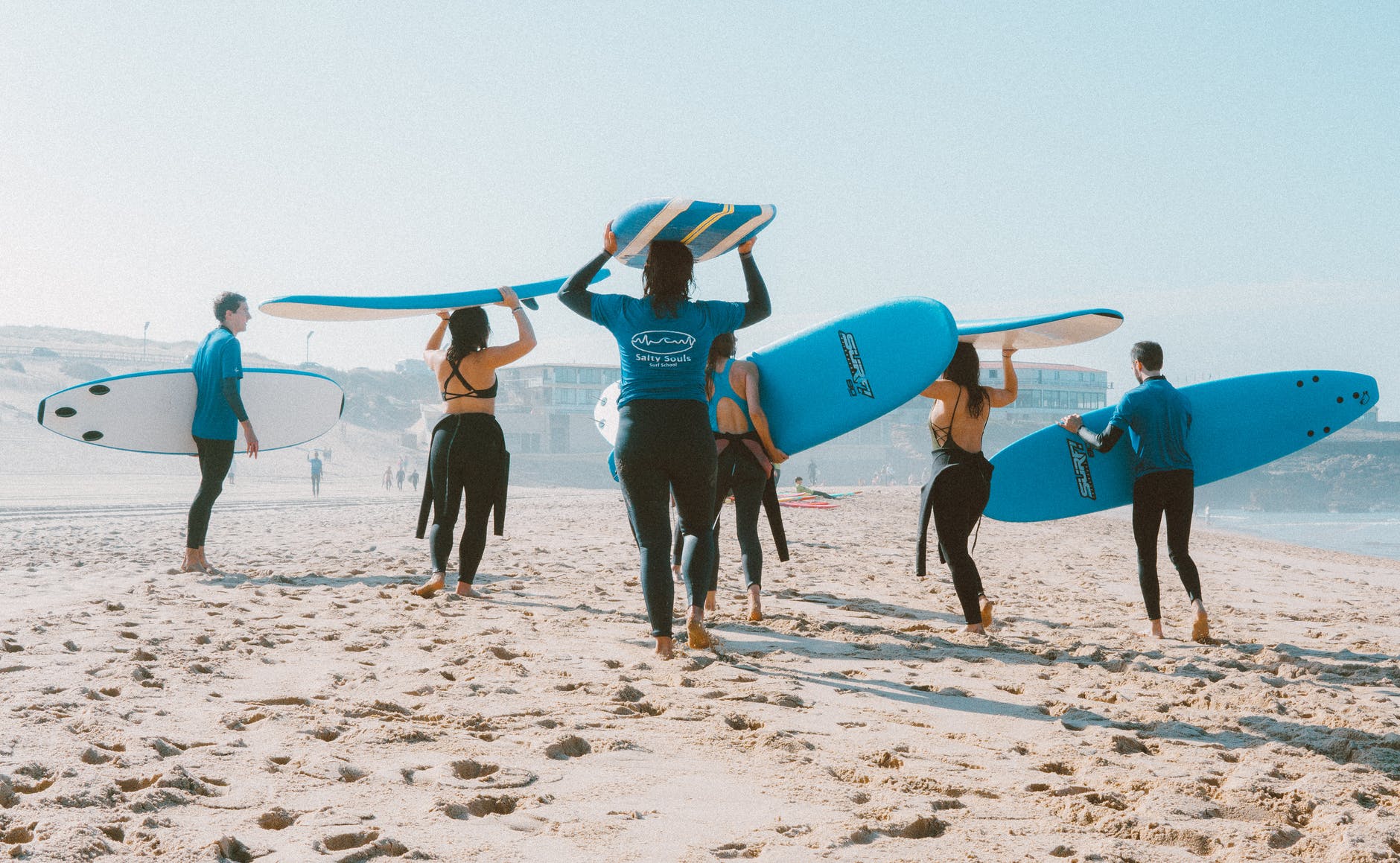 Group of people with surfboards