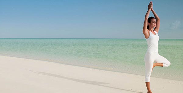 Yoga on the beach at Parrot Cay