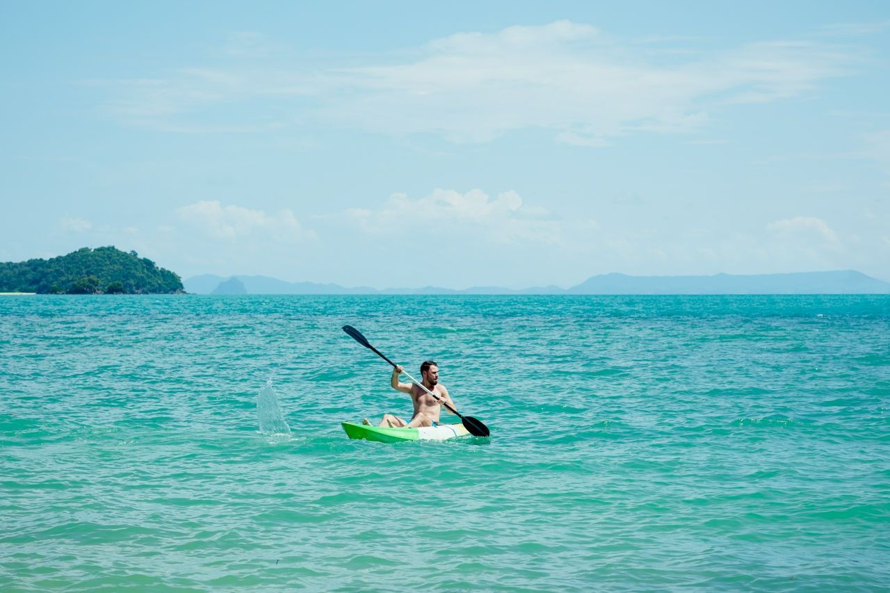 Man kayaking at Amatara Wellness Resort in Thailand