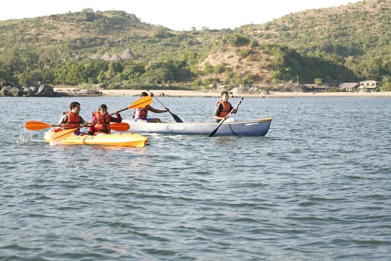 View of boat and beach at SwaSwara