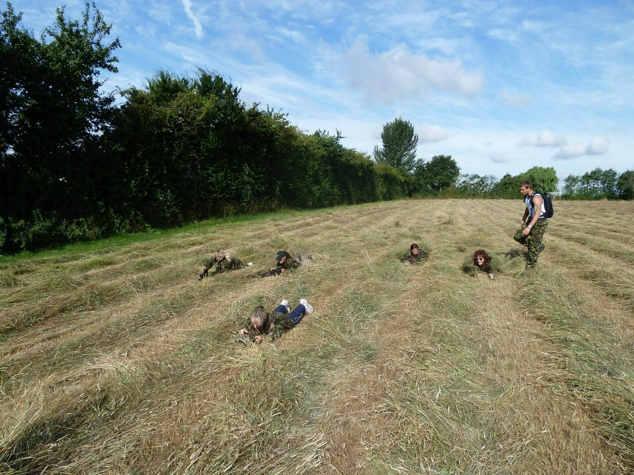 Women crawling on the grass