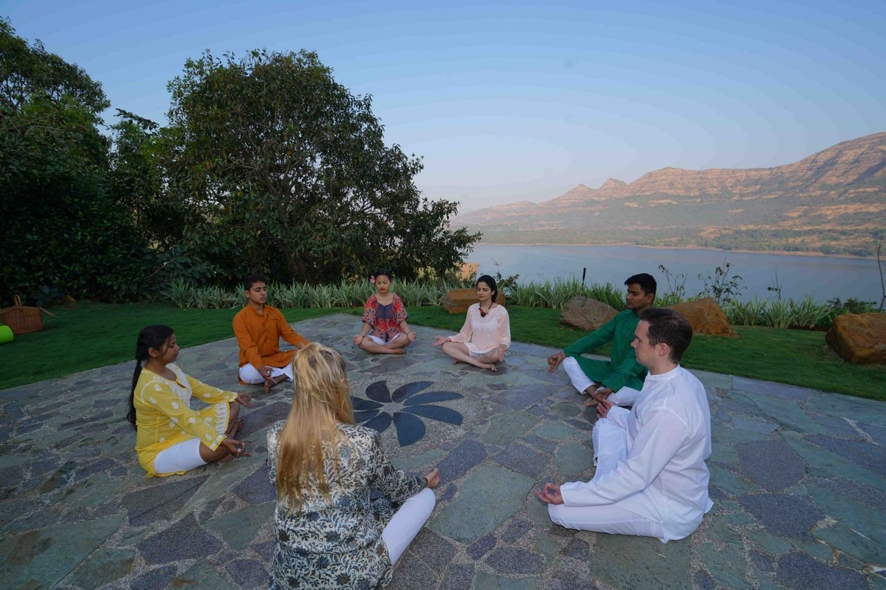 Group meditation cirlce at Atmantan Wellness Resort in India