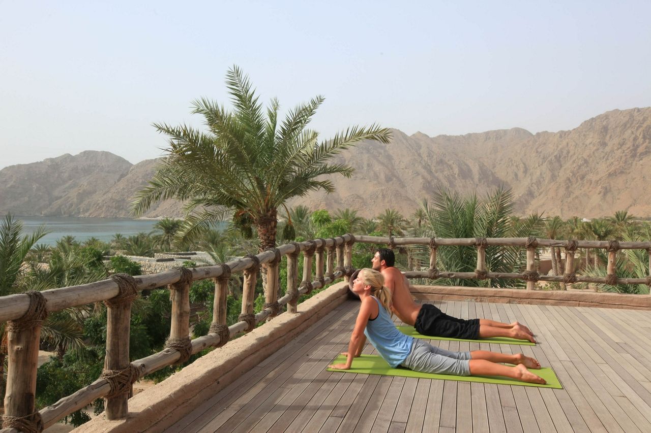 Couples yoga at Six Senses Zighy Bay