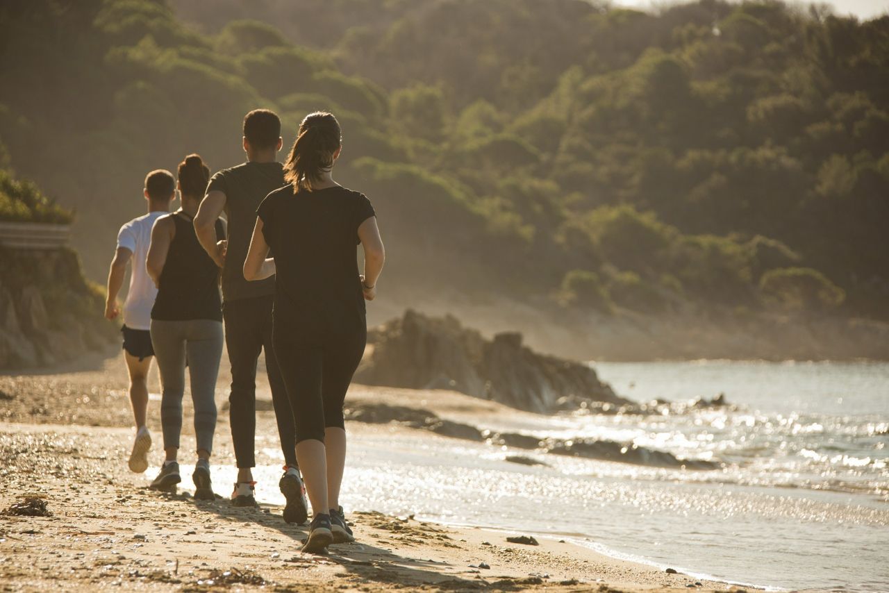 group run on beach at lily of the valley