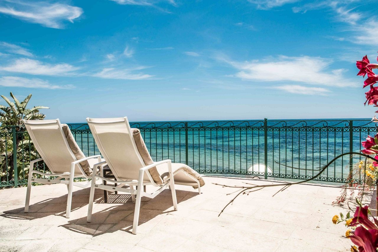 Deckchairs at Forte Village looking out onto the sea