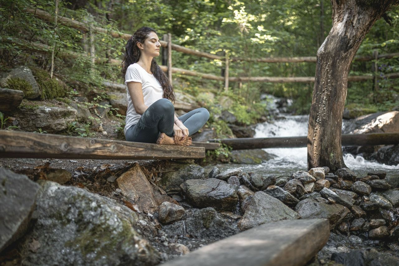 Woman meditating at Preidlhof in Italy