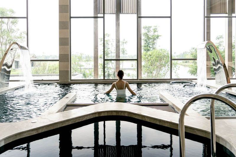 RAKxa Wellness & Medical retreat pool with women enjoying the spa facilities