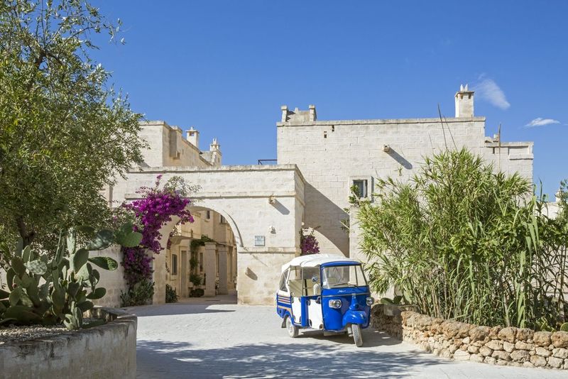 Entrance to Borgo Egnazia with a little blue tuk tuk