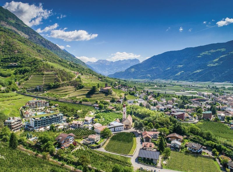 Preidlhof from an aerial view with beautiful green valleys and mountains
