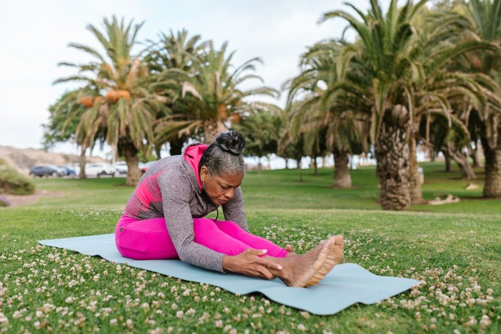 woman doing a folded seat yoga pose