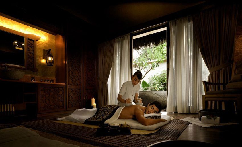 Man receiving ayurvedic spa treatment at The Banjaran Hotsprings Retreat in Malaysia