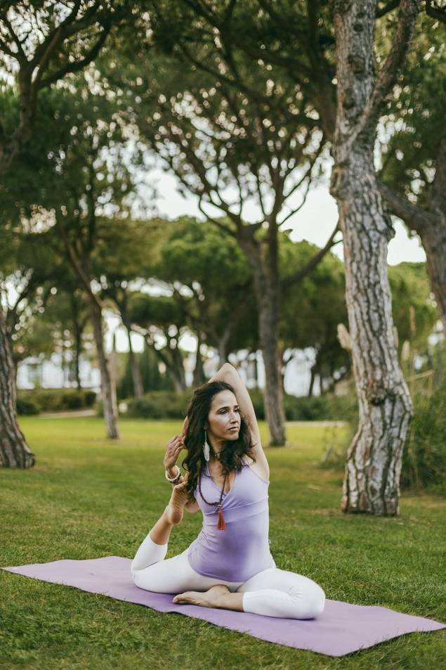 Woman doing a yoga pose and stretch at Pine Cliffs Resort