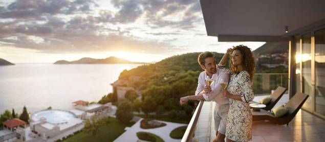 Couple overlooking balcony at Sun Gardens
