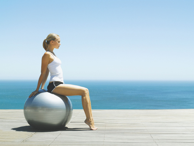 Woman on exercise ball at Conrad Algarve