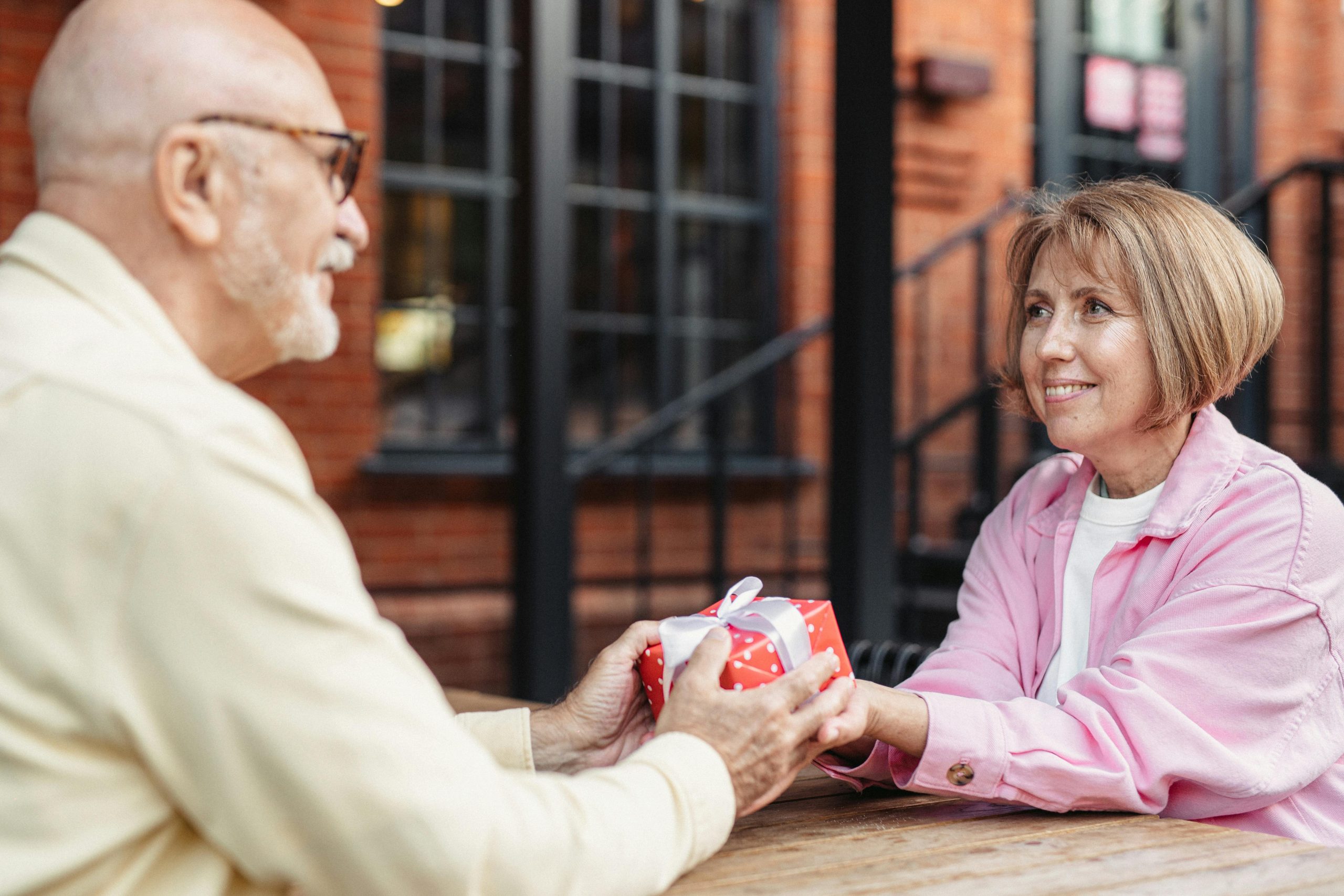 Couple exchanging a wrapped gift