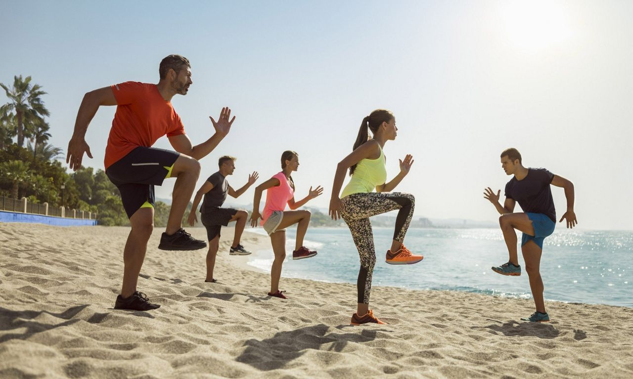 Group fitness class on the beach at Marbella Club