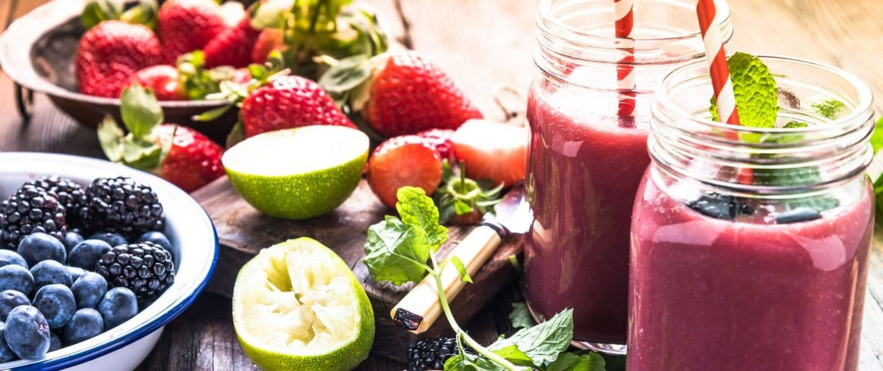 Bowls of berries with smoothies