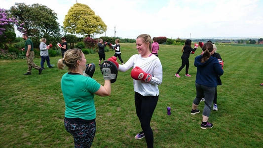 Women boxing at GI Jane Bootcamp