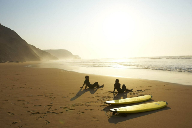Surfers Sitting on the Beach