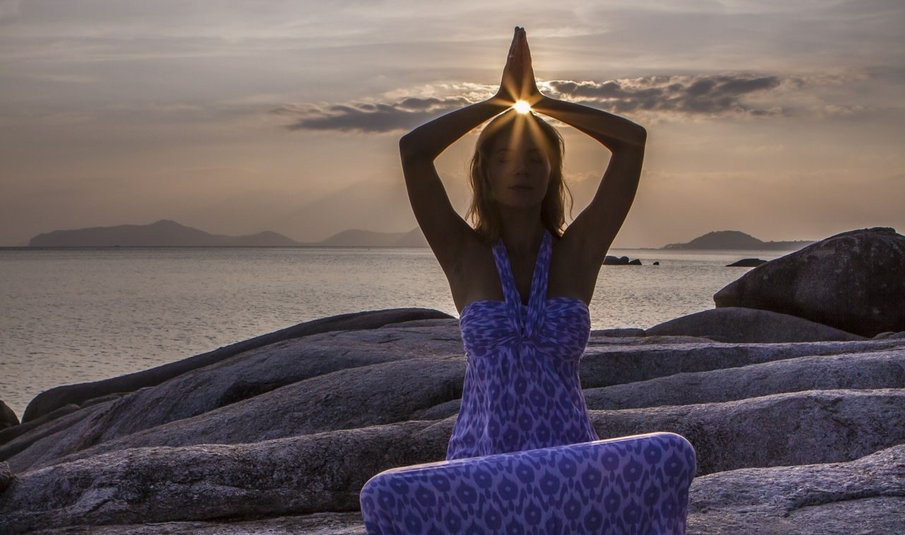 Woman meditating at Kamalaya in Thailand