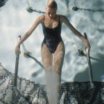 Jana with black bathing suite in pool