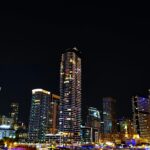 Stunning night view of the Dubai Marina skyline with illuminated skyscrapers reflecting urban vibrancy.